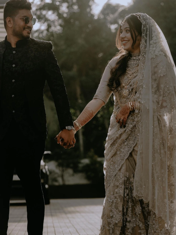 couple holding hands and looking at each other