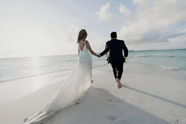couple on beach photoshoot sunset